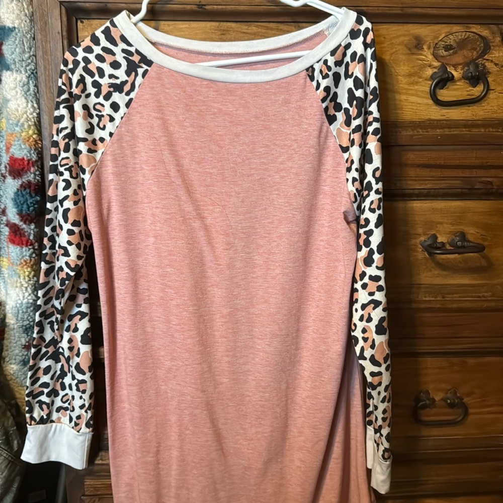 Large pink shirt with leopard sleeves. Great condition. Large but fits bigger.